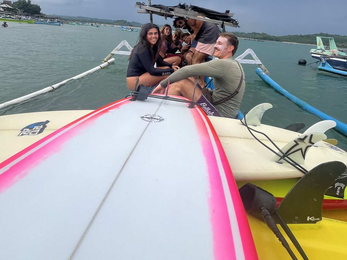 Boards, fins and leashes loaded on the boat before a session